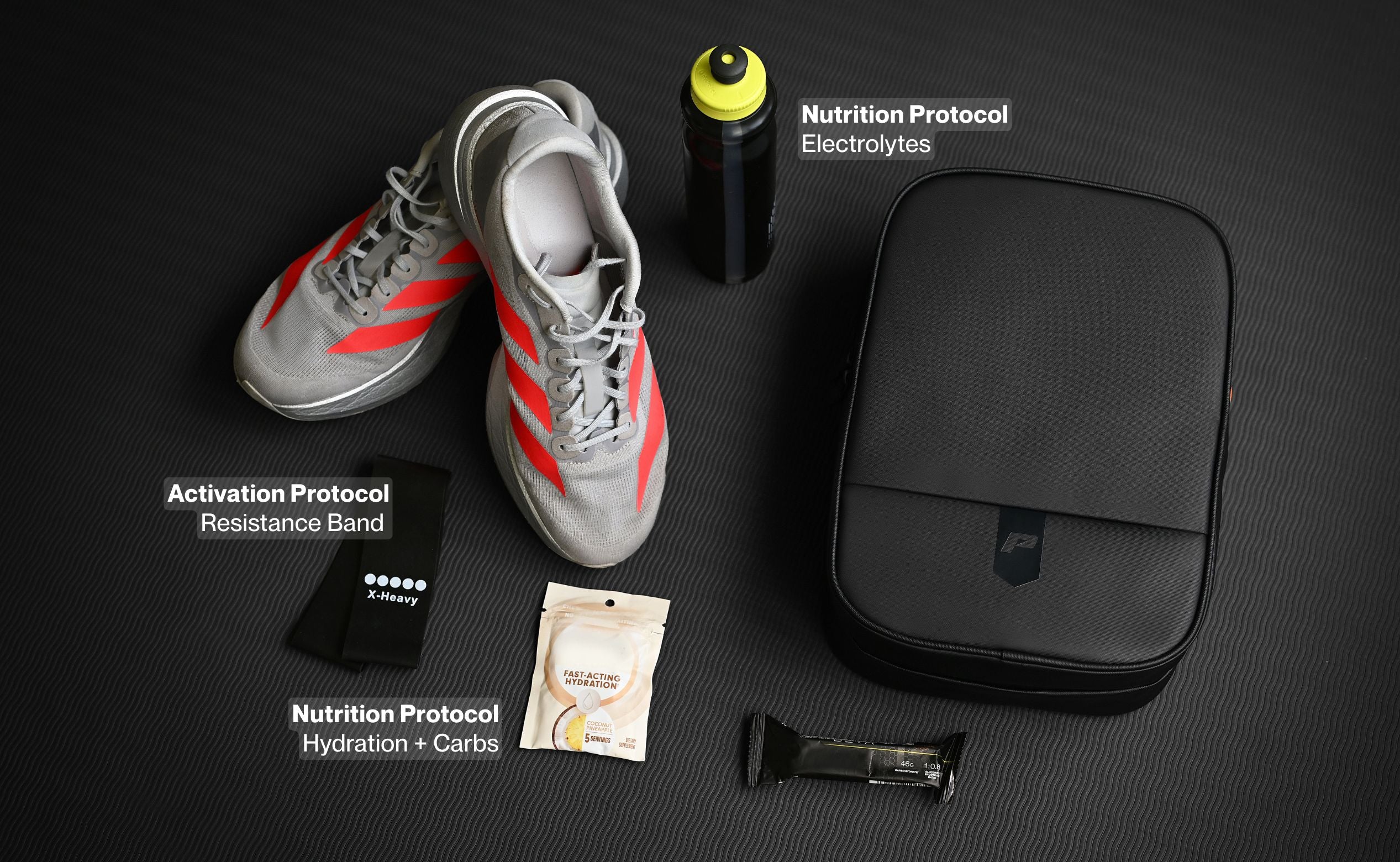 Kinetic Boot Bag packed for a conditioning session with running shoes, resistance band, and energy bar